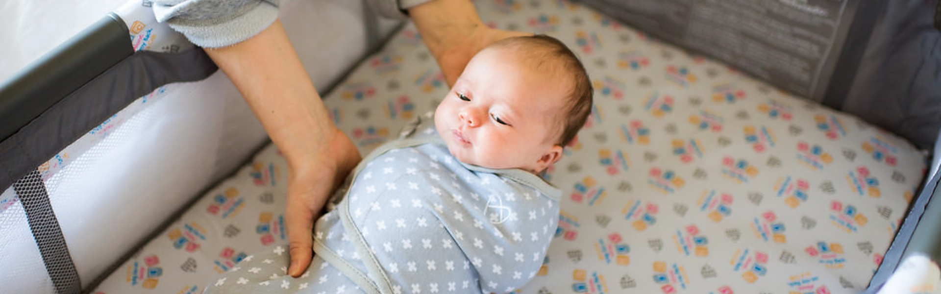 dad and mom holding and smiling at happy baby, WIC logo
